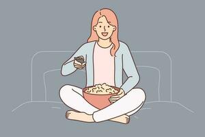 donna con tv a distanza giri su serie seduta su letto nel Camera da letto e detiene tazza di Popcorn. ragazza utilizzando tv a distanza godendo Guardando caratteristica film o sera mostrare su cavo o sputnik televisione vettore