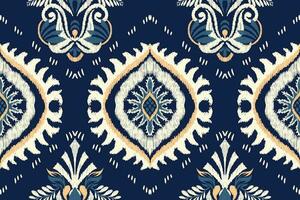 ikat floreale paisley ricamo su Marina Militare blu sfondo.ikat etnico orientale senza soluzione di continuità modello tradizionale.azteco stile astratto vettore illustrazione.disegno per trama, tessuto, abbigliamento, avvolgimento, decorazione