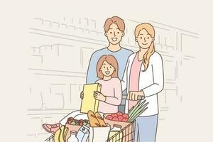 contento famiglia nel supermercato con cestino pieno di prodotti per preparare delizioso e salutare pasto. famiglia a drogheria memorizzare guardare a telecamera, in posa vicino scaffali pieno con merce vettore