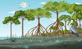 scena del paesaggio della foresta di mangrovie durante il giorno con molti animali diversi vettore