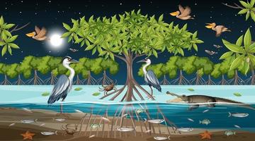 scena del paesaggio della foresta di mangrovie di notte con molti animali diversi vettore