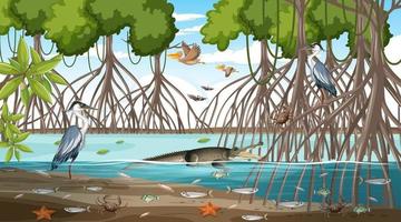 scena del paesaggio della foresta di mangrovie durante il giorno con molti animali diversi vettore