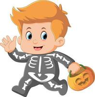 ragazzo del fumetto che indossa il costume da scheletro di halloween che tiene il cesto di zucca vettore
