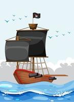 una nave pirata con bandiera jolly roger nell'oceano vettore