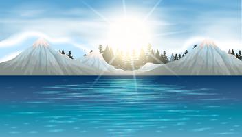 Scena della natura con montagne di neve e lago vettore