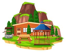Scena con casa in legno e campo vettore
