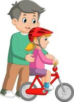 cura papà insegnamento figlia per cavalcata bicicletta per il primo tempo vettore