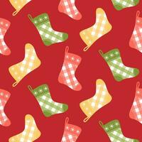 senza soluzione di continuità modello con Natale calze autoreggenti su isolato rosso sfondo. vacanza design per Natale casa arredamento, vacanza saluti, Natale e nuovo anno celebrazione. vettore