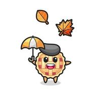 cartone animato della torta di mele carina che tiene un ombrello in autunno vettore