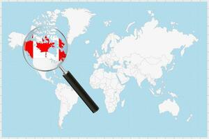ingrandimento bicchiere mostrando un' carta geografica di Canada su un' mondo carta geografica. vettore