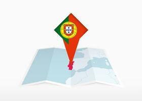 Portogallo è raffigurato su un' piegato carta carta geografica e appuntato Posizione marcatore con bandiera di Portogallo. vettore