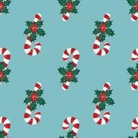 rosso agrifoglio frutti di bosco, Natale a strisce caramelle su un' blu sfondo. Natale senza soluzione di continuità modello. vettore illustrazione.