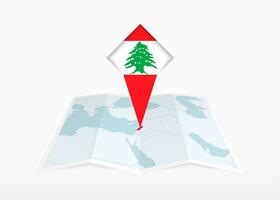 Libano è raffigurato su un' piegato carta carta geografica e appuntato Posizione marcatore con bandiera di Libano. vettore