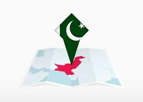 Pakistan è raffigurato su un' piegato carta carta geografica e appuntato Posizione marcatore con bandiera di Pakistan. vettore