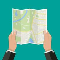 piegato carta carta geografica nel mano, astratto generico città carta geografica con strade, edifici, parchi, fiume. vettore illustrazione nel piatto design su verde sfondo
