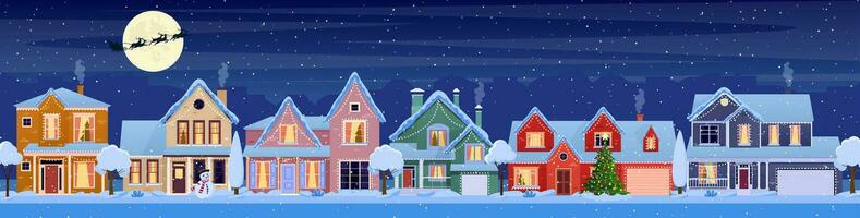 Residenziale case con Natale decorazione a notte. cartone animato inverno paesaggio strada con neve su tetti e ghirlande, Natale albero, pupazzo di neve. Santa Claus con Cervi nel cielo. vettore illustrazione