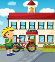 Scena della scuola con ragazzo e bici vettore