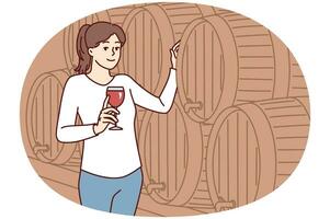 donna con bicchiere di vino sta vicino di legno barile per tintura di alcolizzato bere. vettore Immagine