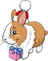 personaggio animale coniglietto dei cartoni animati con regalo nel periodo natalizio vettore
