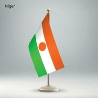 bandiera di Niger sospeso su un' bandiera In piedi. vettore