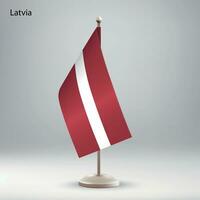 bandiera di Lettonia sospeso su un' bandiera In piedi. vettore