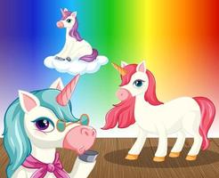 unicorni su sfondo sfumato arcobaleno vettore