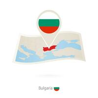 piegato carta carta geografica di Bulgaria con bandiera perno di Bulgaria. vettore