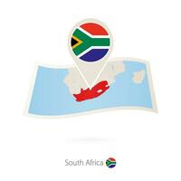 piegato carta carta geografica di Sud Africa con bandiera perno di Sud Africa. vettore