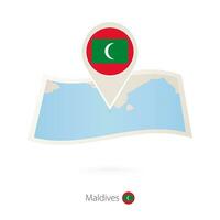 piegato carta carta geografica di Maldive con bandiera perno di Maldive. vettore