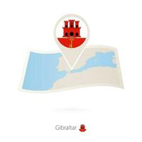 piegato carta carta geografica di Gibilterra con bandiera perno di Gibilterra. vettore