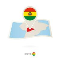 piegato carta carta geografica di Bolivia con bandiera perno di Bolivia. vettore