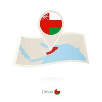 piegato carta carta geografica di Oman con bandiera perno di Oman. vettore