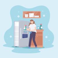 donna che pulisce un frigorifero vettore