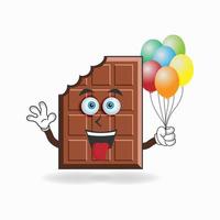 personaggio mascotte di cioccolato che tiene un palloncino. illustrazione vettoriale