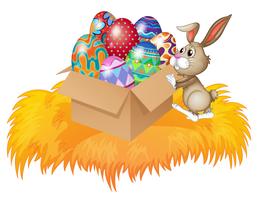 Un coniglio che spinge una scatola piena di uova di Pasqua vettore