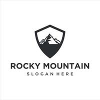 roccia montagna con scudo logo design vettore