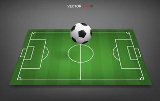 campo di calcio o sfondo del campo di calcio con pallone da calcio. campo in erba verde per creare una partita di calcio. vettore. vettore