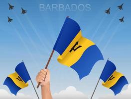 bandiere delle barbados che sventolano sotto il cielo blu vettore