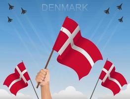 bandiere della Danimarca che sventolano sotto il cielo blu vettore