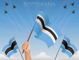 bandiere del botswana che sventolano sotto il cielo blu vettore