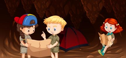 Bambini in campeggio nella grotta vettore