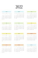 Modello di calendario 2022 in classico stile rigoroso con elementi multicolori. calendario mensile pianificazione individuale minimalismo design sobrio per notebook aziendale. la settimana inizia di domenica vettore