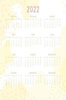 Calendario 2022 per agenda personale e taccuino. punti e punti astratti disegnati a mano gialli caldi, stile delicato e tenero. la settimana inizia di domenica vettore