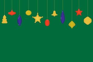 decorazioni natalizie sotto forma di palline, alberi di natale, campana, stelle di colore rosso, blu e giallo su sfondo verde. copia spazio vettore