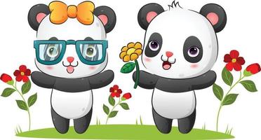 la coppia di panda felici sta regalando un girasole all'amico in giardino vettore