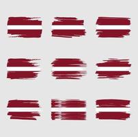pennellate di bandiera della Lettonia dipinte vettore