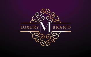 m lettera logo luxury.royal monogramma design vettore