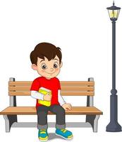 cartone animato felice ragazzo seduto su una panchina con in mano un libro vettore