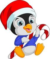 simpatico pinguino con cappello da Babbo Natale che tiene caramelle vettore