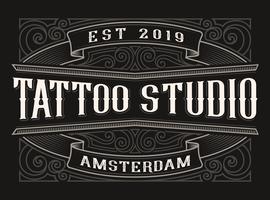 Logo vintage per tattoo studio vettore